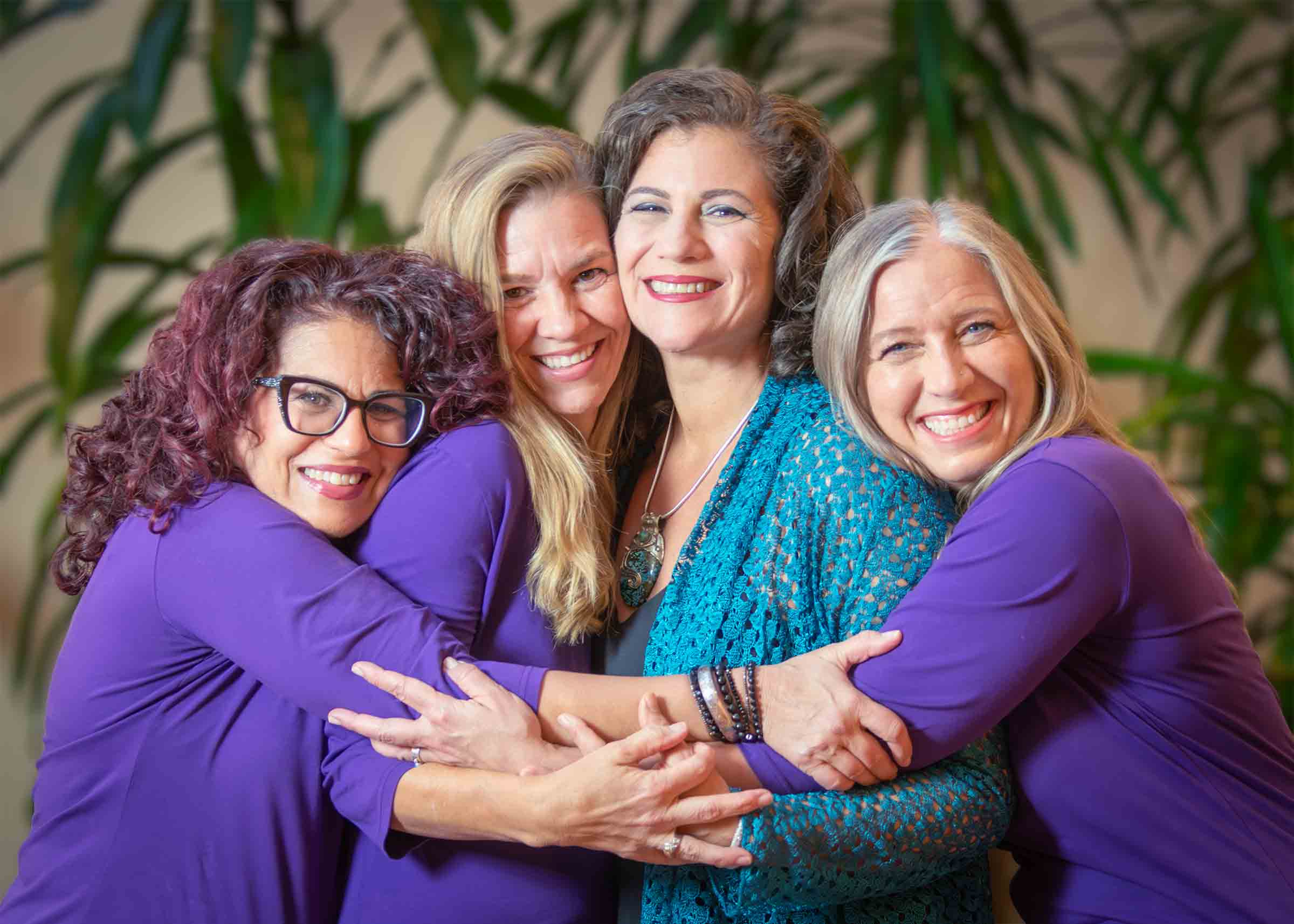 marconics core teaching team hugging