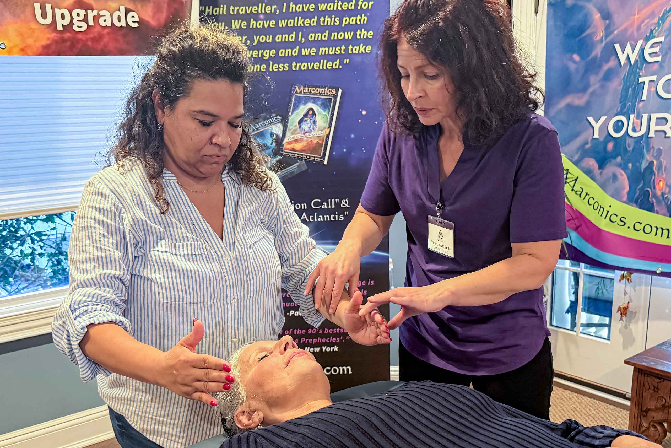 Marconics Teacher Vanessa Nicoletta - adjusts student's hands